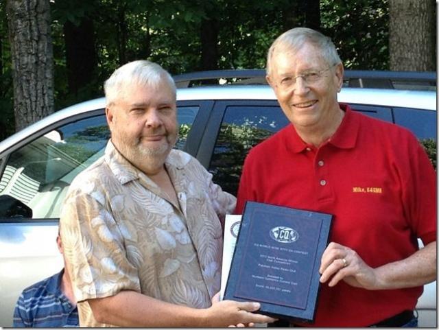 Lar K7SV presenting Mike K4GMH the club CQWWRTTY award from 2012